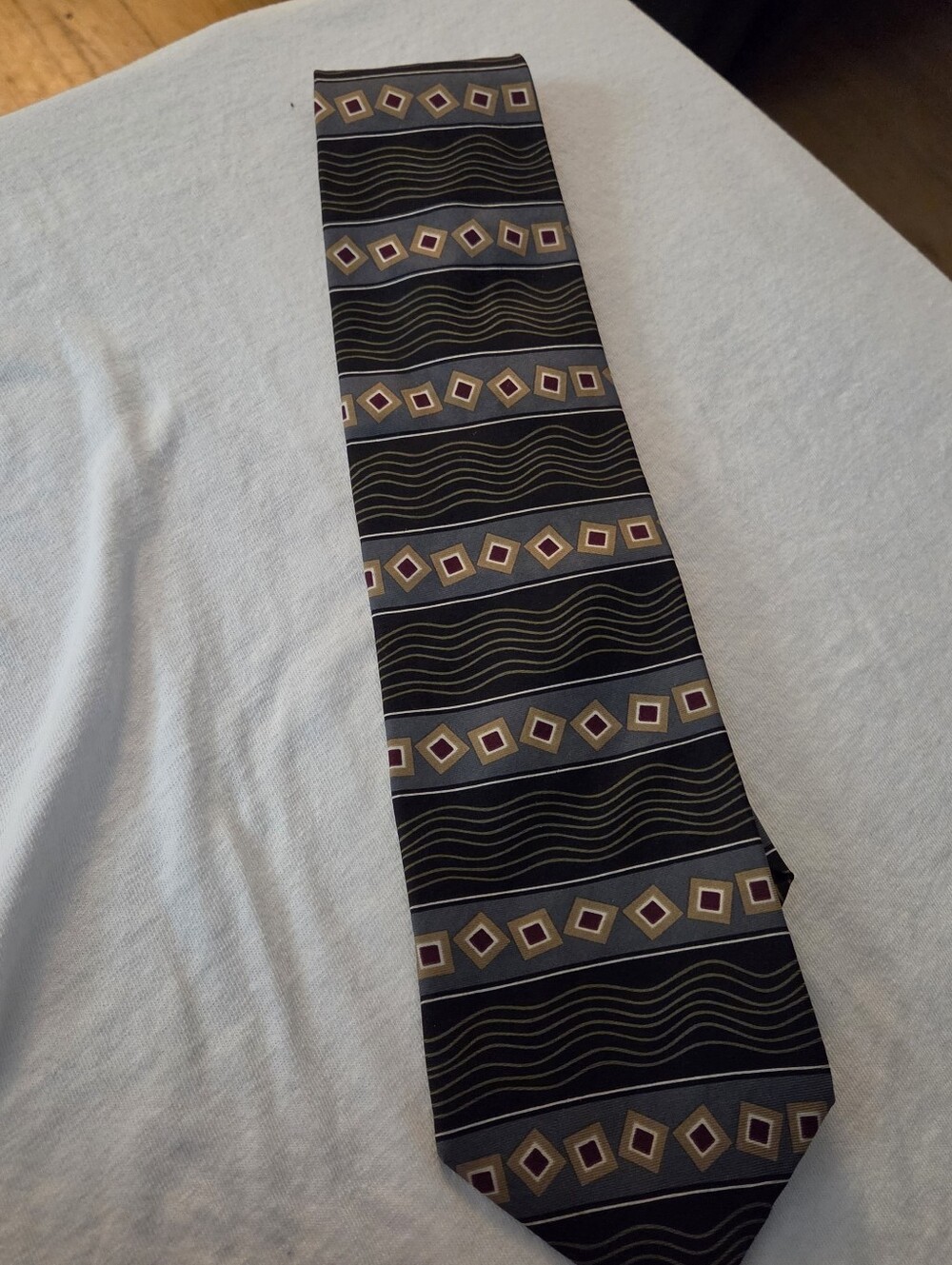 Black Geometric Stripe Men's Tie with Gold and Purple Accents